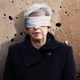 Illustration for article titled Theresa May Narrowly Manages To Survive Parliamentary Firing Squad